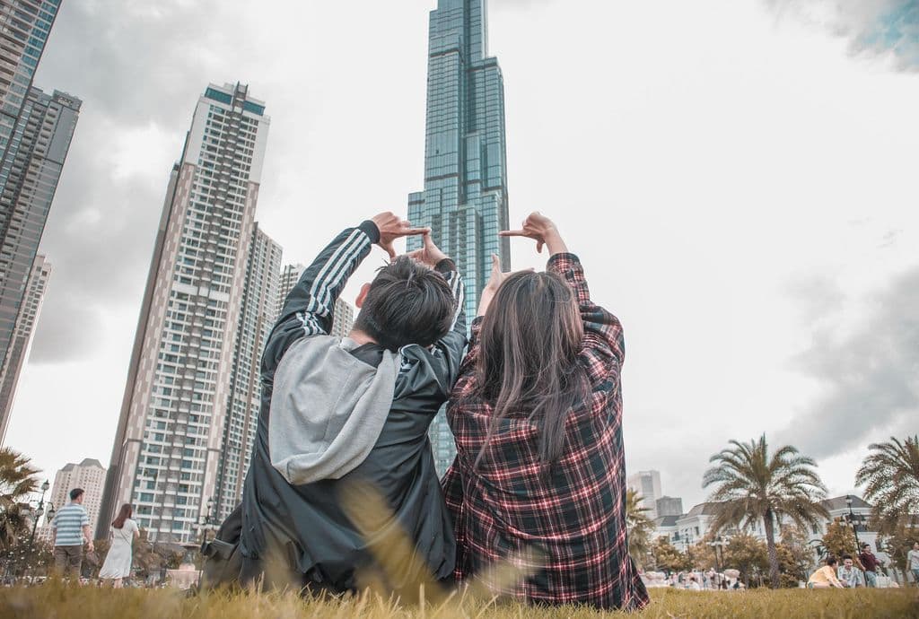 Couple looking at a tall building.