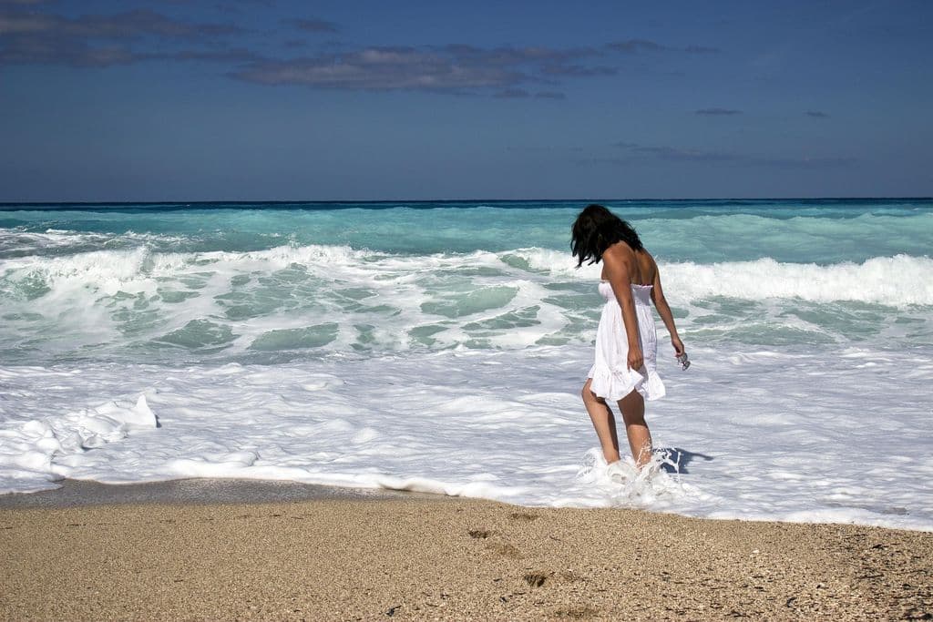 Girl walking on the beach.