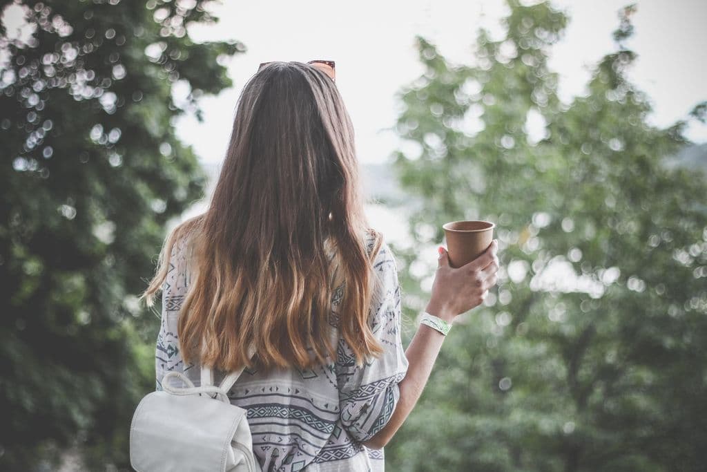 Person holding a cup.